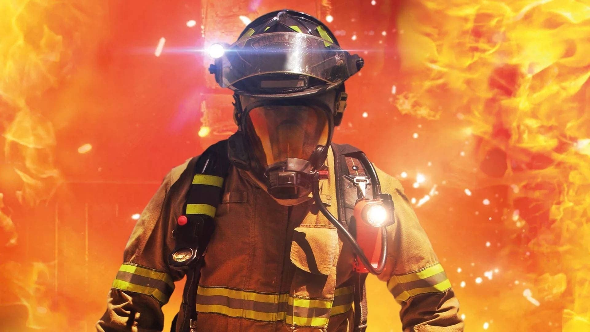 Firefighter in full turnout gear and SCBA walking through flames and falling embers